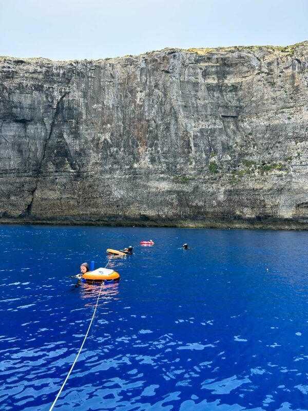 Three freediving buoys under the cliffs of Gozo